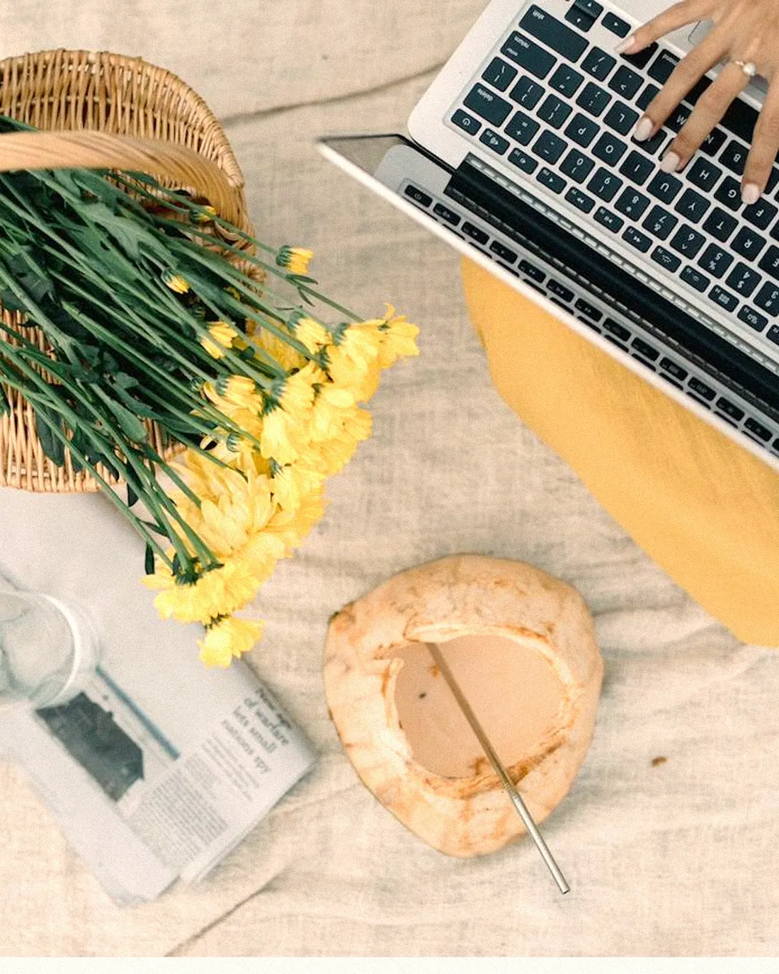 A cream creative studio worktable with brand posters and colour swatches